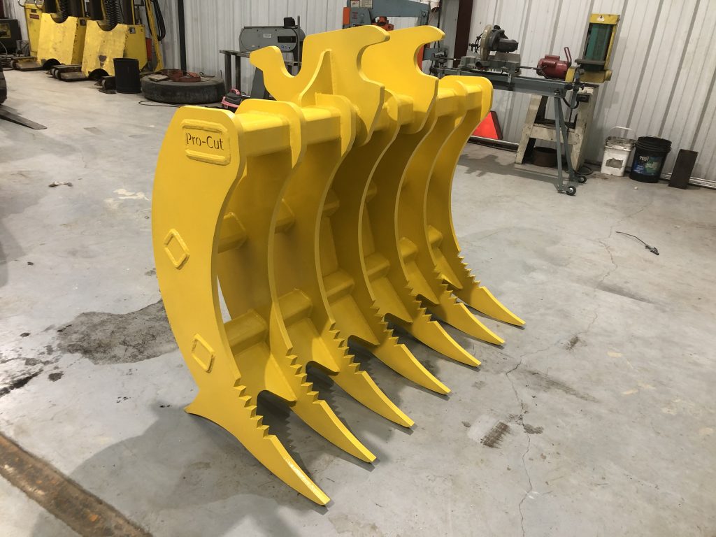A yellow industrial metal scooper attachment for a digging machine.