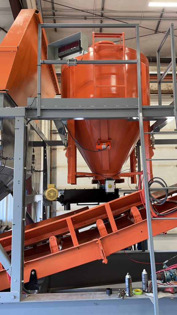 Large orange metal silo.